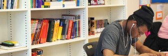 A GED student studies at Seeds of Literacy for his test