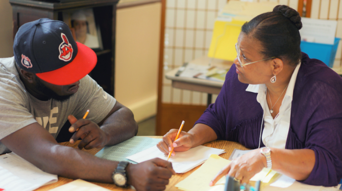 GED graduate Margo Hudson tutors a student at Seeds of Literacy on Cleveland's west side.